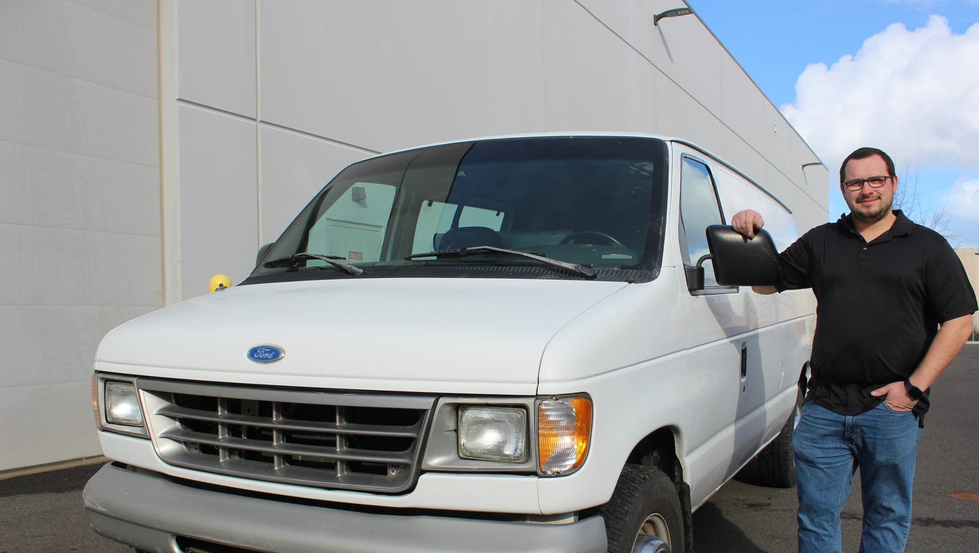 An Empire Cleaning team member with the company van before a North Spokane carpet cleaning job
