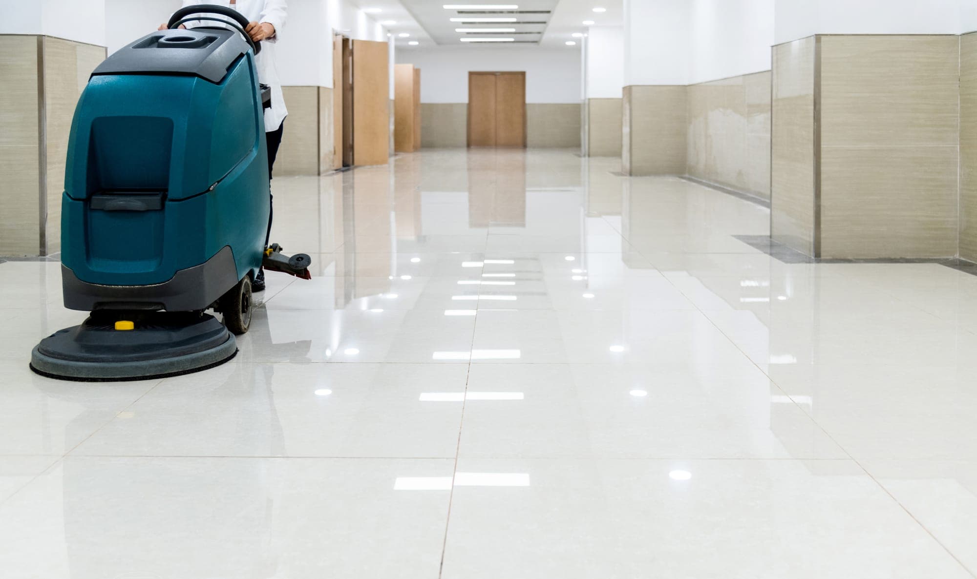 Machine scrubbing a hard floor at a Spokane facility